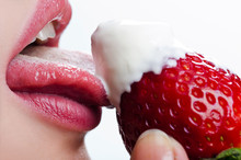 Woman Licks Sour Cream With Strawberry