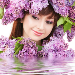 Canvas Print - Young woman with lilac flowers