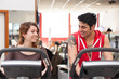 © pio3 - Young couple training in the gym with bike while talking