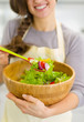 © Alliance - Closeup on fresh vegetable salad in hand of housewife