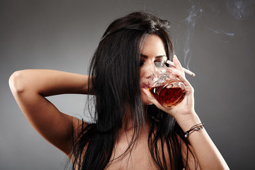 Young woman smoking and drinking