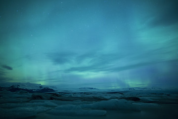 Wall Mural - northern lights above lagoon in iceland