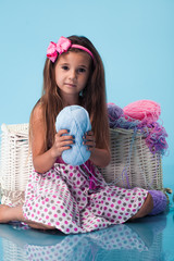 Wall Mural - cute little girl on blue background
