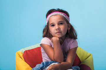 Wall Mural - cute little girl on blue background