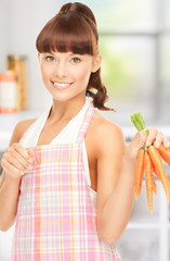 Poster - housewife with carrots at the kitchen