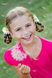 Summer joy -  lovely girl blowing dandelion