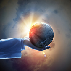 Wall Mural - image of earth planet on hand