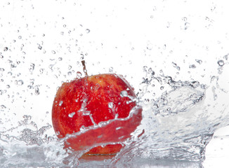 Apple with water splash isolated on white