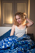 © listercz - young caucasian woman in bed with headache and hangover