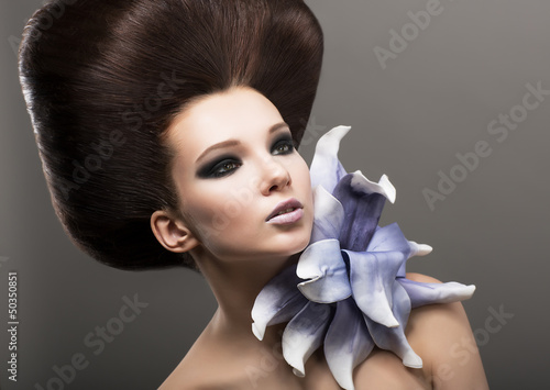 Obraz w ramie Extravagance. Classy Woman with Lily. Stylish Hairdo. Luxury