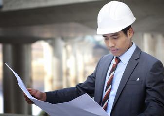 Canvas Print - asian architect on highway construction site