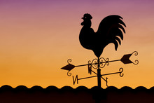Weather Vane In Colorful Sky