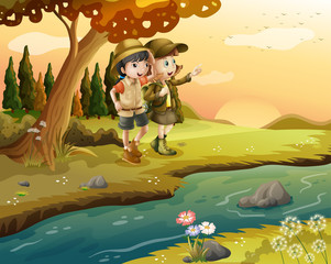 Wall Mural - A girl and a boy at the riverbank