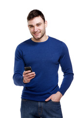 Wall Mural - Man holding a mobile phone isolated on white background