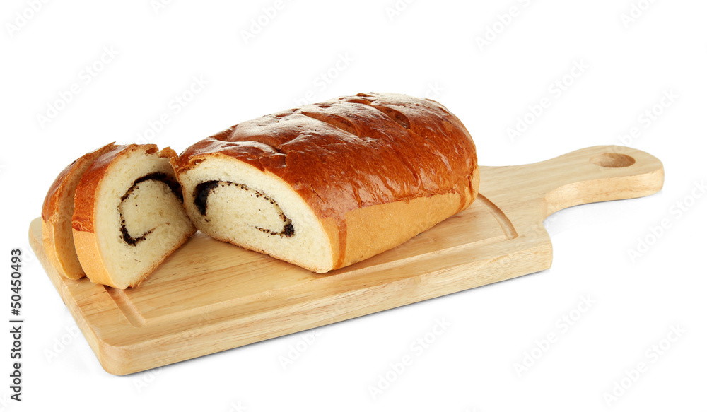 Loaf with poppy seeds on cutting board, isolated on white
