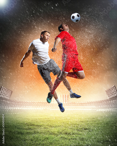 Plakat na zamówienie two football players striking the ball