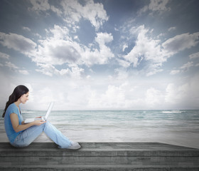 Young woman with laptop computer.