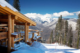 Fototapeta Do pokoju - Wooden ski chalet in snow, mountain view