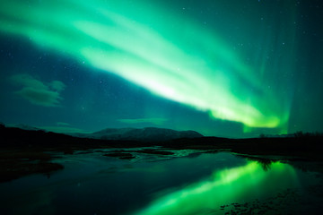 Wall Mural - northern lights above lagoon in iceland