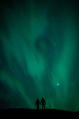 Wall Mural - northern lights above romantic couple