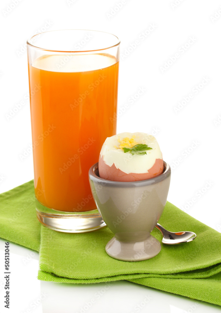 Light breakfast with boiled egg and glass of juice, isolated