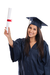 Mixed race college graduate woman in cap and gown