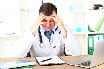 Poster - Medical doctor working at desk