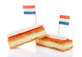 Fototapeta Tulipany - Traditional Dutch pastry called tompouce  with flags