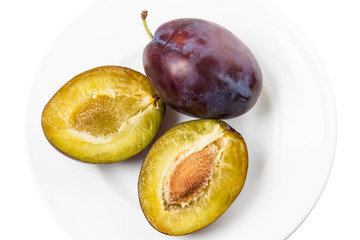 Wall Mural - Two plums on a white plate