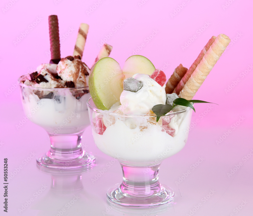 Ice cream with wafer sticks on pink background