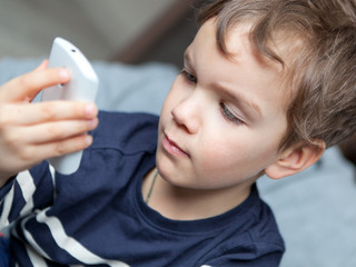 Portrait of boy with mobile phone