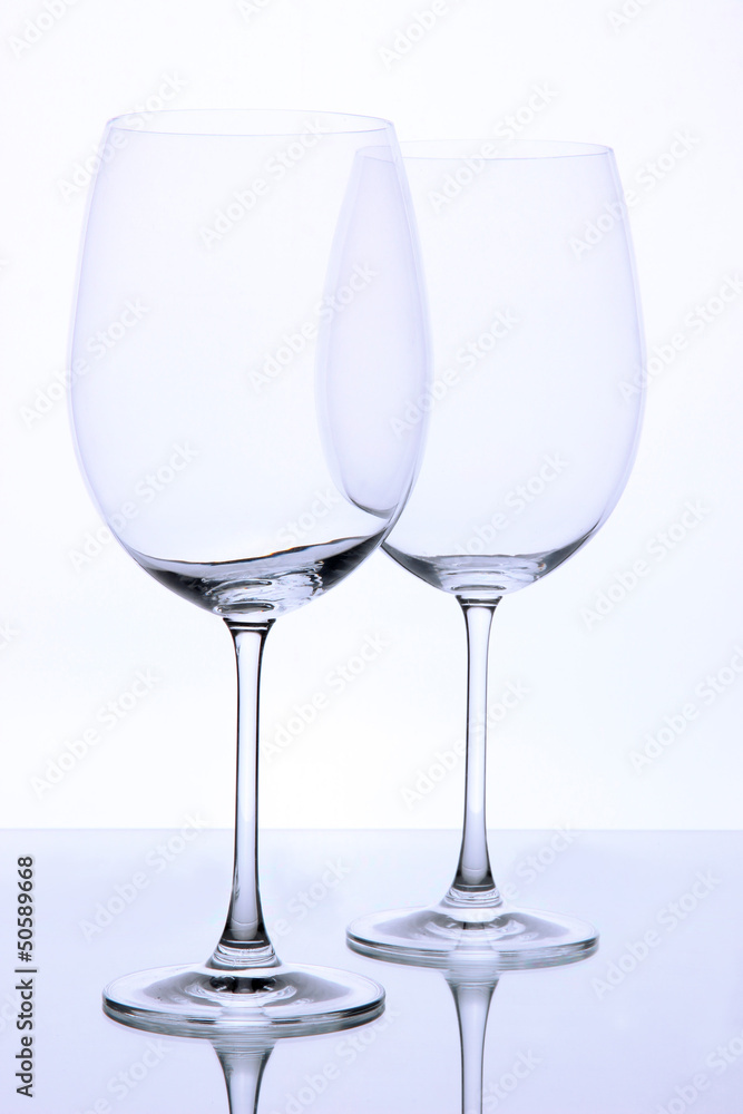 Empty wine glasses arranged and isolated on white