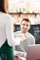 Poster - Waitress serving man at cafe