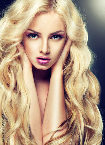 Fototapeta na wymiar Blondy girl with long curly hair