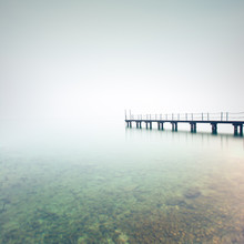 Pier Or Jetty Silhouette In A Foggy Lake. Garda Lake, Italy