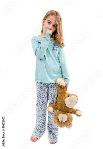 little girl holding teddy bear