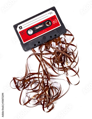 Naklejka na szafę Old worn down eighties cassette with band pulled out