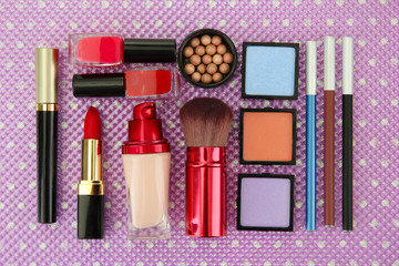 Poster - Decorative cosmetics on purple background