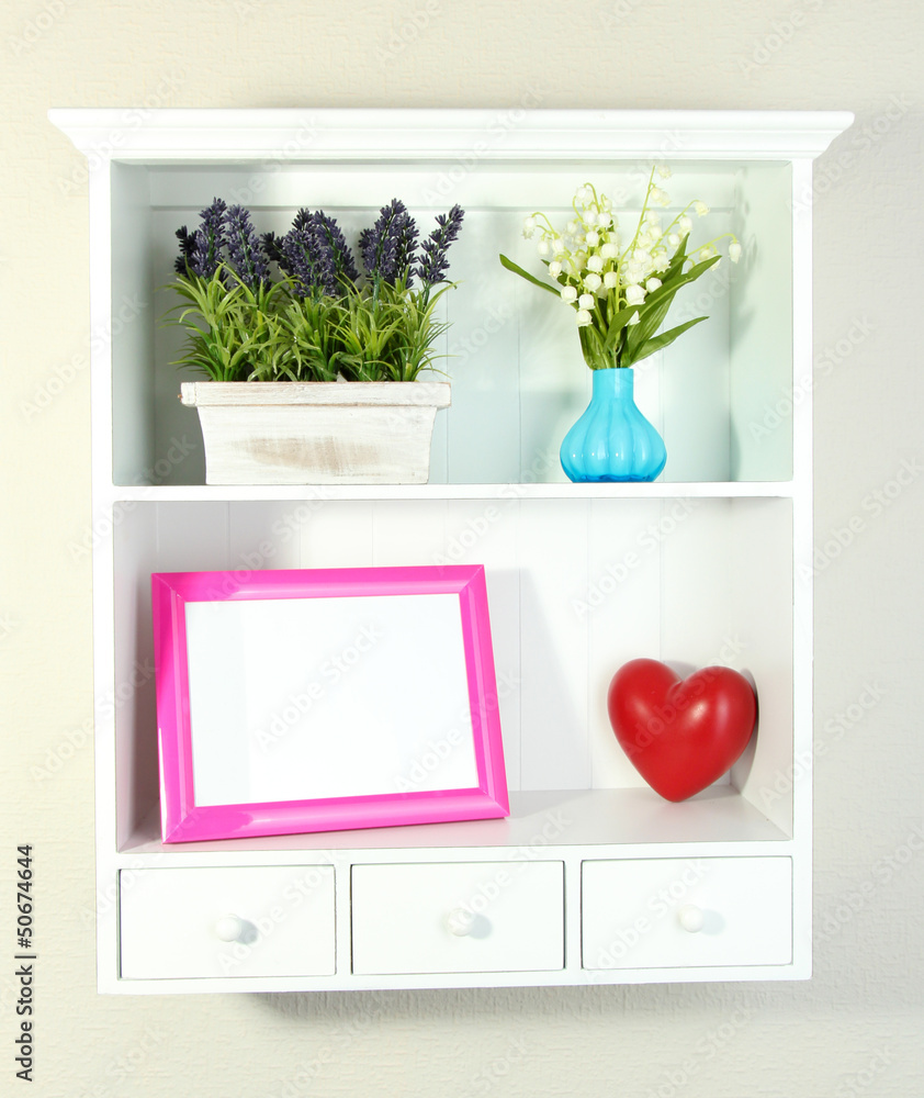 Beautiful white shelves with different home related objects