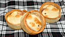 Scottish Meat Pies With Tartan Background
