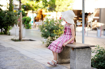 Portrait of beautiful little girl in pink dress