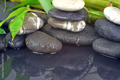 Naklejka na drzwi Wellness concept: Bamboo and black stones