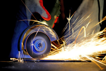 Wall Mural - Worker cutting metal with grinder