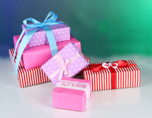 Various gift boxes on a colorful background