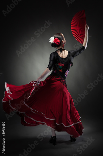 Obraz w ramie young woman dancing flamenco on black