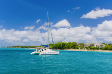 Catamaran In Torquoise Water And Blue Sky