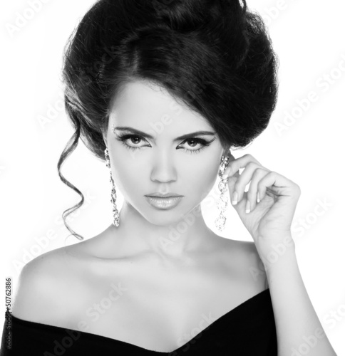 Fototapeta na wymiar Portrait of young beautiful woman with jewelry, black and white