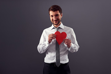 Canvas Print - smiley man holding red heart