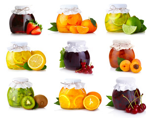 Wall Mural - Set of glass jars with exotic fruits jam isolated