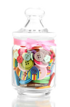 Glass Jar Containing Various Colored Buttons Isolated On White